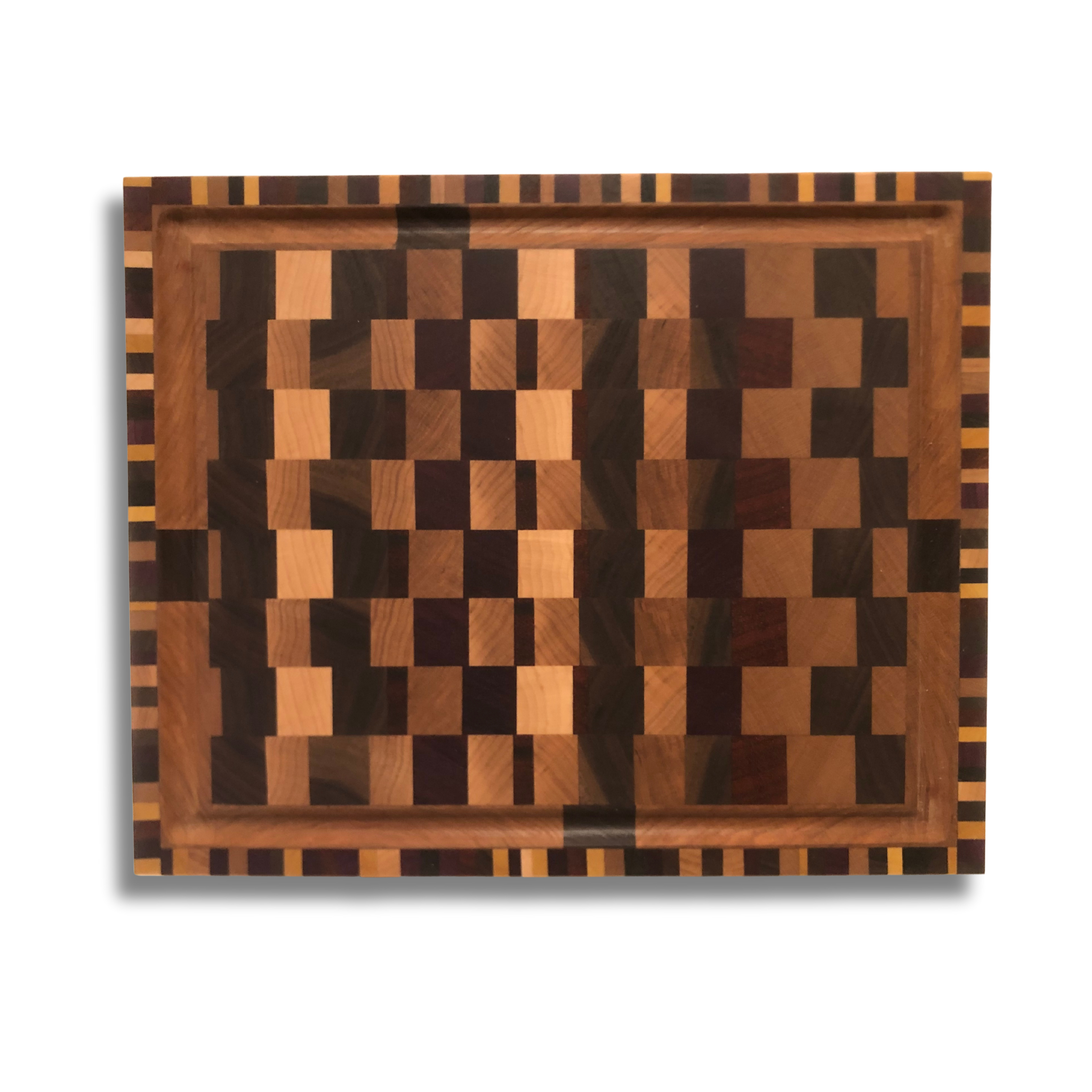 Cutting Board 

Wood Type(s):

Walnut
Maple
Cherry
Wenge
Purple Heart
Yellow Heart
Padauk

Size: 13 x 10 ½ x 1 ½

All lumber comes from local suppliers. All are considered hardwoods. All are natural colors and treated with food-grade mineral oil. No stains are used. All handcrafted by DNKZ Woodworks.